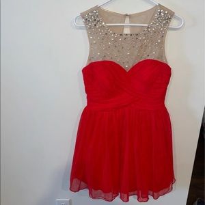Size 8 Red Dress. Goes to knee and only worn once. Beautiful and no blemishes